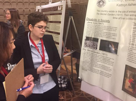 Kathryn presents research at the National Collegiate Honors Council conference in 2018.